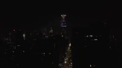 Empire State Building fireworks show July 4th night pulling back Manhattan New York City NYC