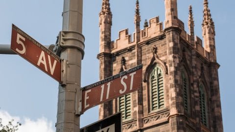 First Presbyterian Church on 5th Ave and 11th Street signs on corner in Manhattan