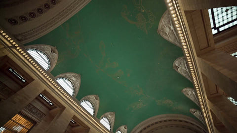 Grand Central Station Terminal interior tilting down to crowded room in summer in NYC