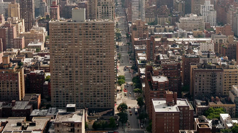 aerial overhead buildings tilting to Empire State cityscape NYC