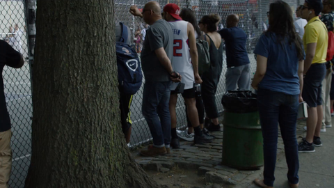 people watching basketball game at West 4th Street and 6th Ave court in slow motion 4K New York City
