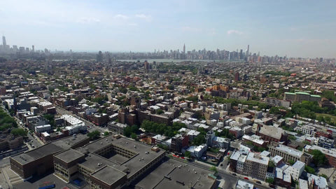 aerial of Brooklyn field with Manhattan skyline on horizon