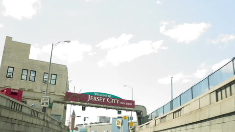 welcome to New Jersey sign from driver pov - driving in car