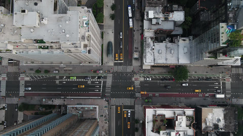 overhead taxis at intersection Manhattan high buildings New York City NYC