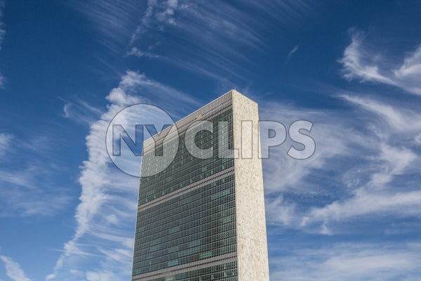 United Nations Building - view from side - isolated on blue sky with clouds on beautiful sunny summer day