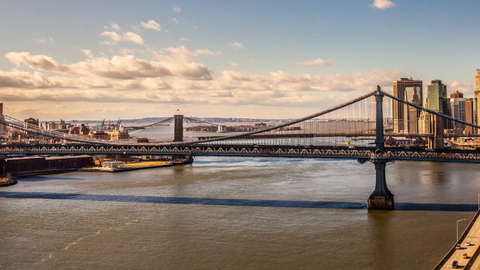 Brooklyn and Manhattan Bridge panning to downtown skyline - day to night timelapse in 4K and 1080 HD NYC