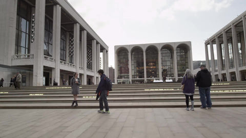 driving past Lincoln Center on fall day - front steps entrance in NYC