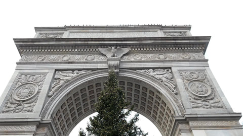 Washington Square Park arch and Christmas tree in winter snowing cold day New York City
