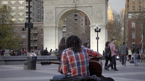 guitar player playing musician in Washington Square Park New York City NYC