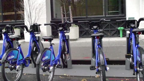 CitiBikes in row - blue bicycles parked at docking station in NYC