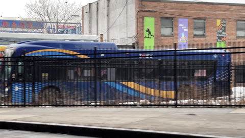 Driving past colorful art mural on street in Williamsburg Brooklyn New York City NYC