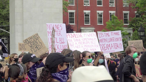 signs at BLM rally in Washington Square Park New York City