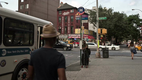 bus doors closing at Cooper Square in East Village on summer day in Manhattan NYC