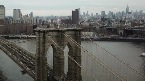 Brooklyn Bridge toward Manhattan over flag 1080