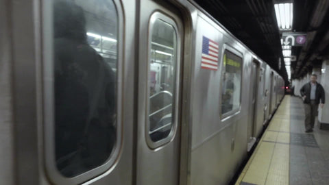 4 train exiting station platform - subway departing from 42nd street in New York City 1080