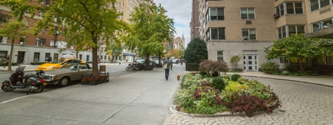 Lower 5th Ave with circular driveway garden in Manhattan NYC