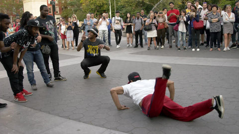 breakdancer performing - dancing in Washington Square Park - breakdancing on summer day