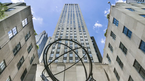 timelapse of Atlas statue outside Rockefeller Center tilting down from skyscraper to sculpture in 1080 HD in NYC