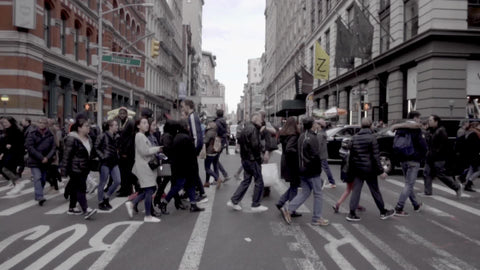 crowded busy crosswalk on Prince Street and Broadway in SoHo Manhattan in slow motion NYC