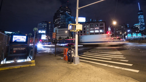 zooming out slowly from Canal st subway station with Freedom Tower at night - 4K timelapse in Downtown Manhattan NYC