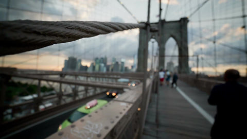 close-up of suspension rope on Brooklyn Bridge at sunset on summer day in NYC