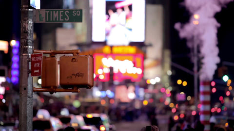 Times Square steam pipe with sign and cars driving in traffic at night in 1080 HD in NYC