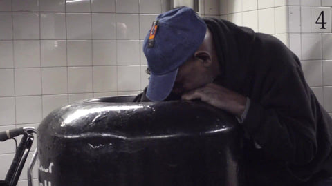 man digging in garbage can in subway station in 4K and 1080 HD in NewYorkCity