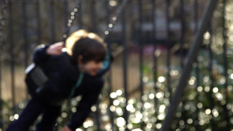 children playing on swings, kids swinging on playground in Washington Square Park in slow motion in 1080 HD and 4K NYC