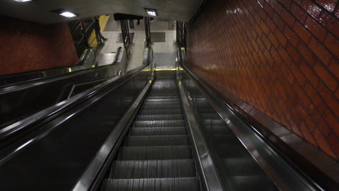 down escalator in subway station - empty with no one riding in first person perspective pov 1080 HD in NYC