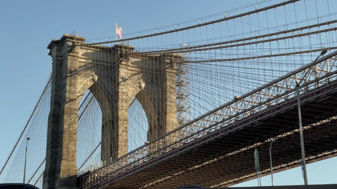 Brooklyn Bridge tilitng down to Lower East Side LES Downtown Manhattan New York City street NYC