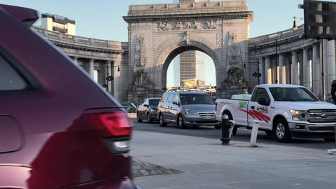 passing Manhattan Bridge entrance arch to Brooklyn in Lower East Side New York City NYC