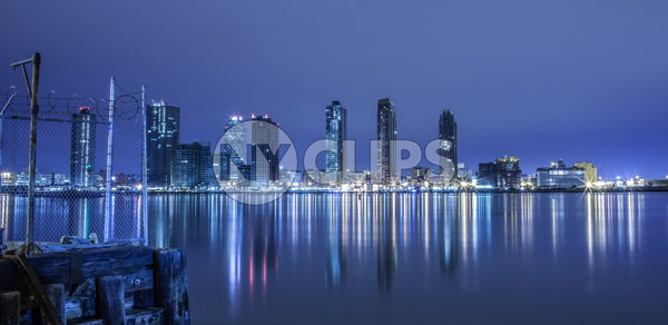 New Jersey skyline view from Westside of Manhattan at night across Hudson River with beautiful reflections in water