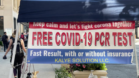 free Covid-19 PCR test sign on medical tent in New York City NYC