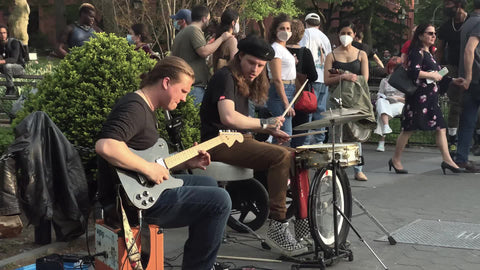 band playing live music for crowd in Washington Square Park NYC