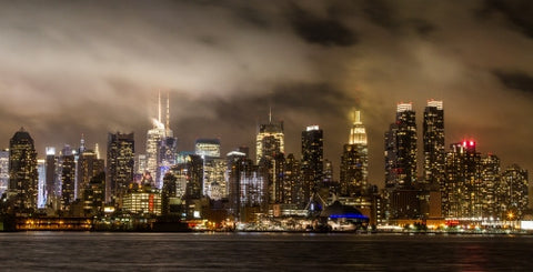 Manhattan skyline on cloudy muggy night with Empire State Building