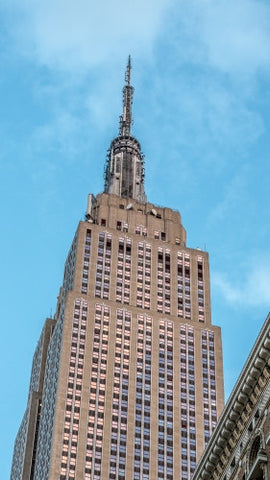 Empire State Building on bright blue sky during day