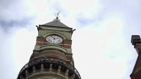 clock tower on Jefferson Market Library close up zooming out to street in Greenwich Village in NYC