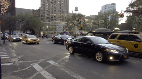 taxicab driving past Union Square on fall day
