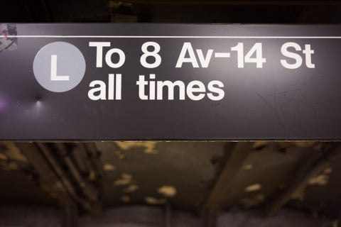 L train all times sign in 8th Ave and 14th st subway station