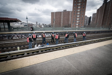 MTA workers on elevated subway station track on 125th Street in Harlem, Uptown Manhattan