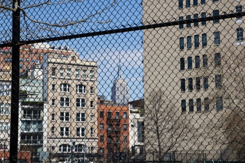 Empire State Building seen through fence