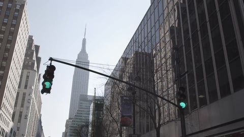 driving through green light with view of Empire State Building from 34th Street in NYC