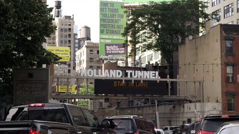 cars lined up in gridlocked traffic entering Holland Tunnel