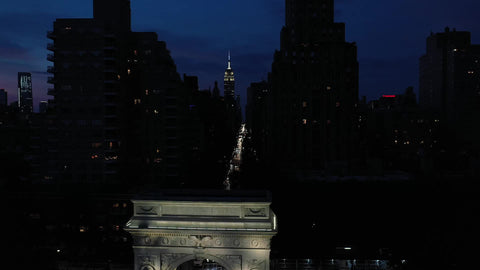 reverse Washington Square Park toward arch night slow Manhattan New York City NYC