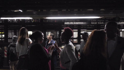 diversity on subway train platform - black women sharing smartphone photo in 1080 HD in NYC