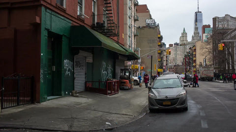 quiet street in Chinatown with bicycle and Freedom Tower in background in fall
