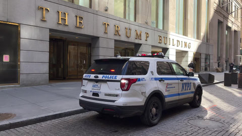 The Trump Building with police car in Financial District Manhattan New York City NYC