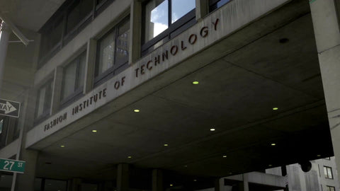 zooming out from Fashion Institute of Technology aka FIT with students walking by do not enter sign on bright sunny day in slow motion, NYC 1080 HD