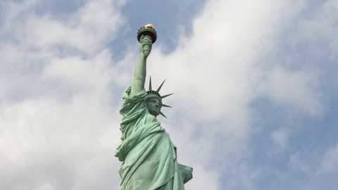 Statue of Liberty medium close-up shot on angle - 4K upward view timelapse in New York City