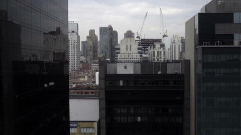 passing buildings and skyscrapers with aerial view from moving tram in 1080 HD in NYC